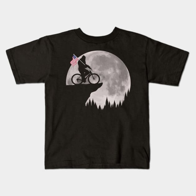 Bigfoot Riding BIke American Flag Kids T-Shirt by Tesszero